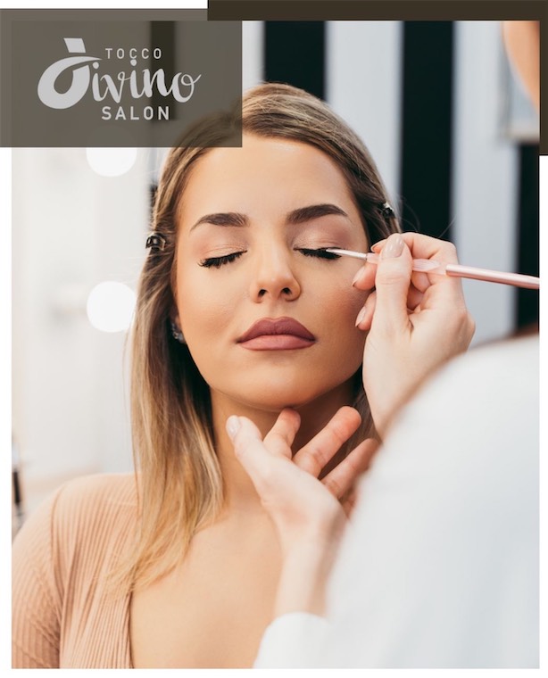 Makeup artist applying eyeliner