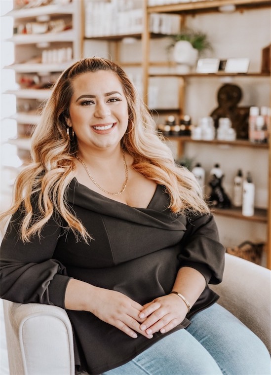 Smiling client relaxing in a salon chair