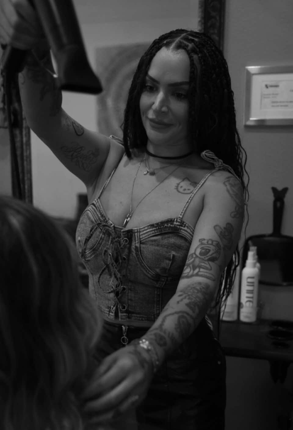 Stylist blow-drying and styling a client's hair