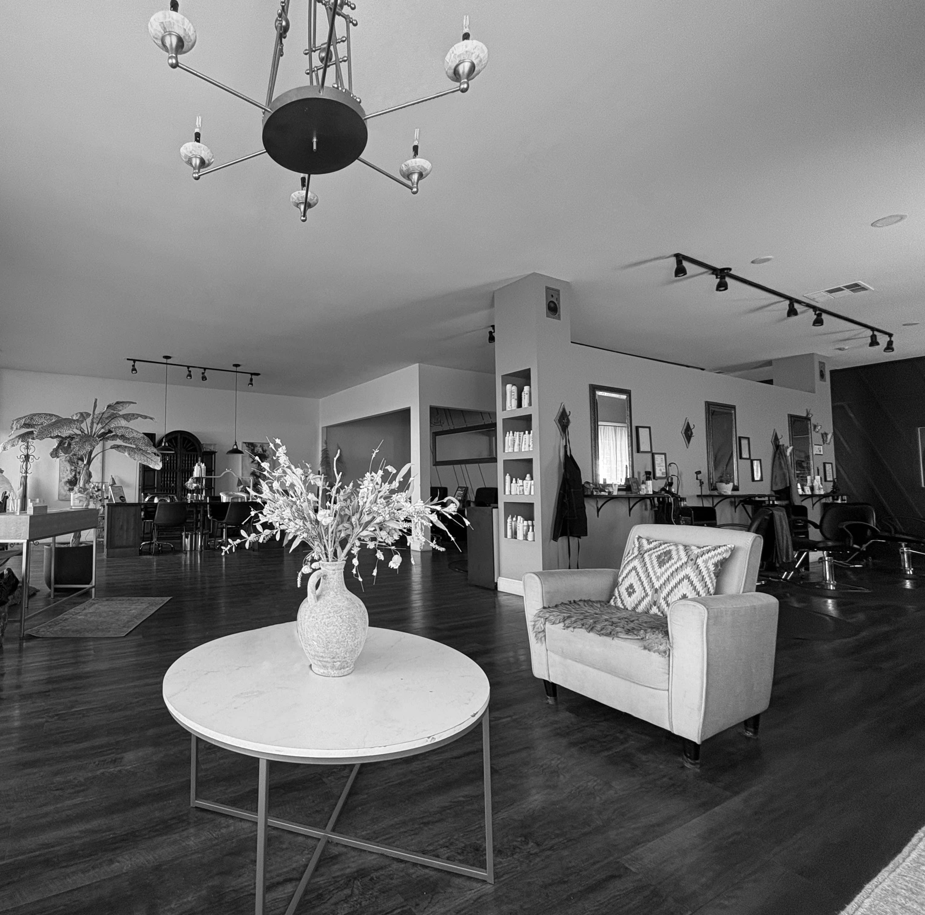 Welcoming lounge seating inside Tocco Divino Salon in Stockton, CA