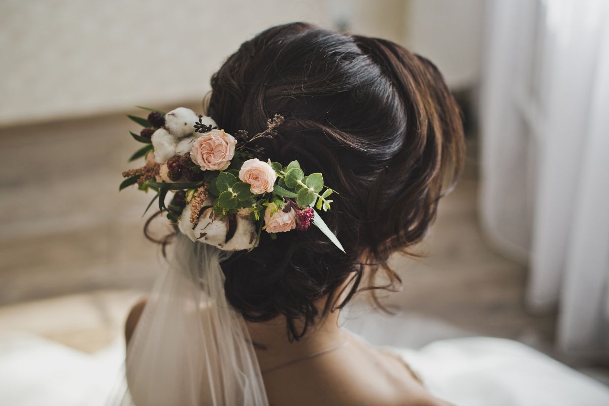 Bridal updo with floral accents