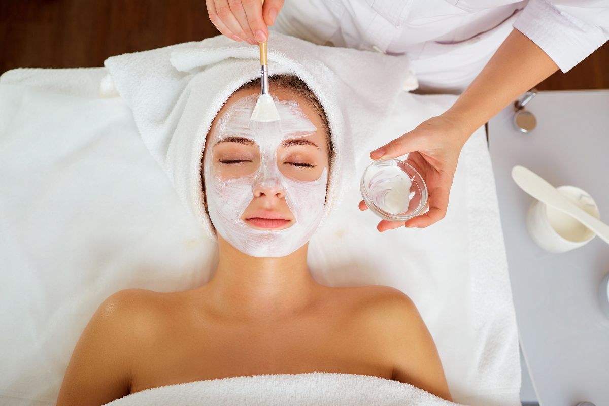 Client relaxing during a hydrating facial mask treatment